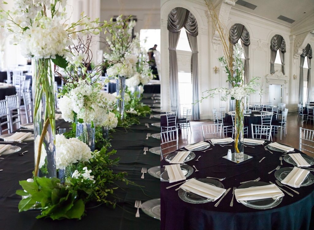 Black and white wedding table setup with greenery